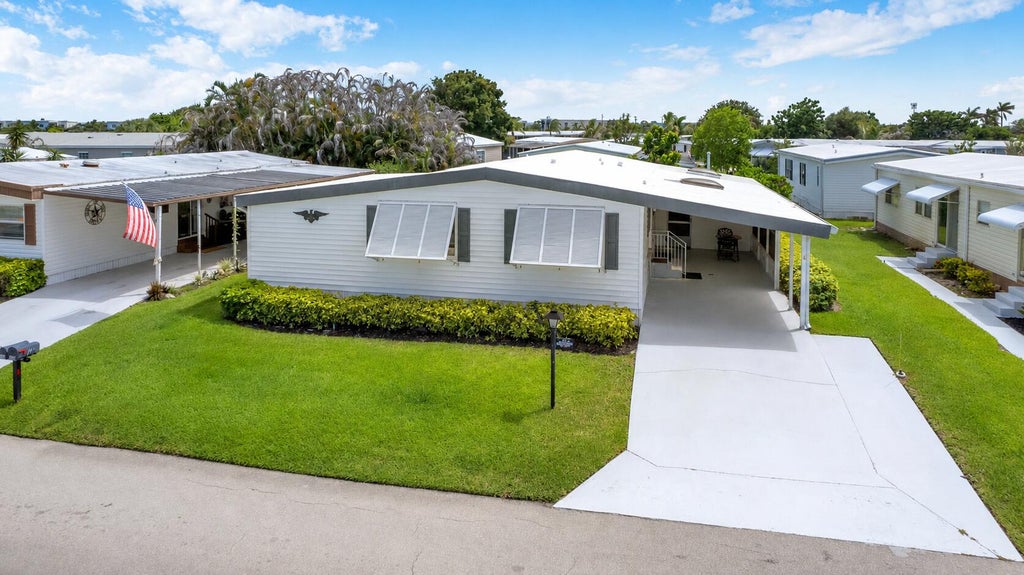 Photo of 140 NE Pinelake Village Boulevard, Jensen Beach, FL 34957 (MLS # B26055243)