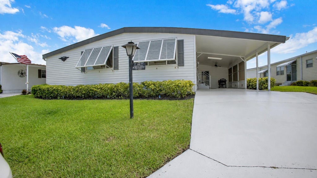 Photo of 140 NE Pinelake Village Boulevard, Jensen Beach, FL 34957 (MLS # B26055243)