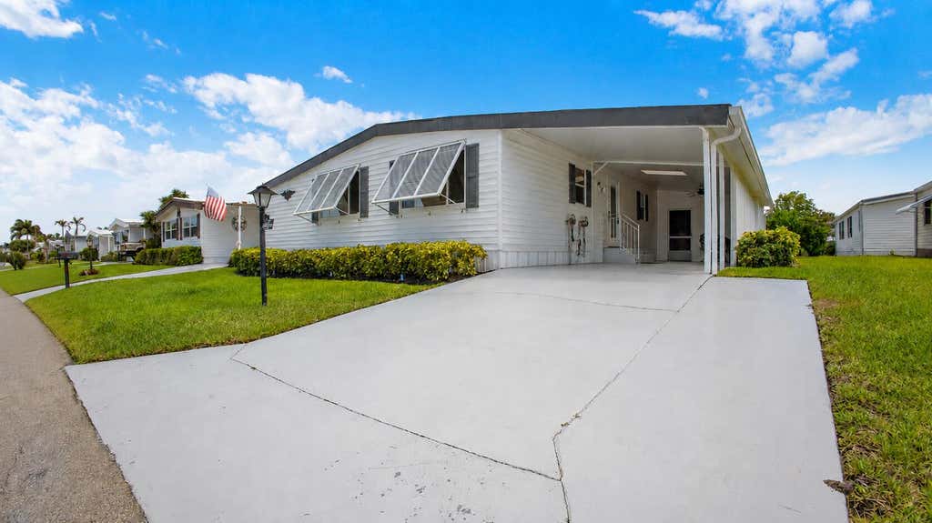 Photo of 140 NE Pinelake Village Boulevard, Jensen Beach, FL 34957 (MLS # B26055243)