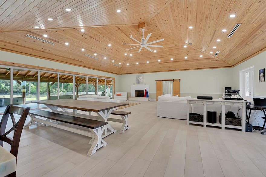 Country living with High level finishes you would normally see in a waterfront mansion. 15 Minutes west of Palm City in Unincorporated Martin County sits this 20 Acre homesite 3 paddocks of 5 acres each. This home will not disappoint! Huge 1242 sq ft living room with 17 ft Wood ceiling perfect for entertaining. Smart Home technology and 400-amp service.48 Kw Standby Generator and 500 Gallon Propane tank. Bluestar range and ovens and Sub-Zero refrigerator, Scotsman icemaker,50-amp hookup for motorhome. and huge kitchen Island. 2 master suites in the home perfect for multi-generational living. Upgraded insulation and efficiency electrical bill has not gone over $250 ever!! Barn with living quarters as well for any workers coming in with dedicated bathroom and electrical.