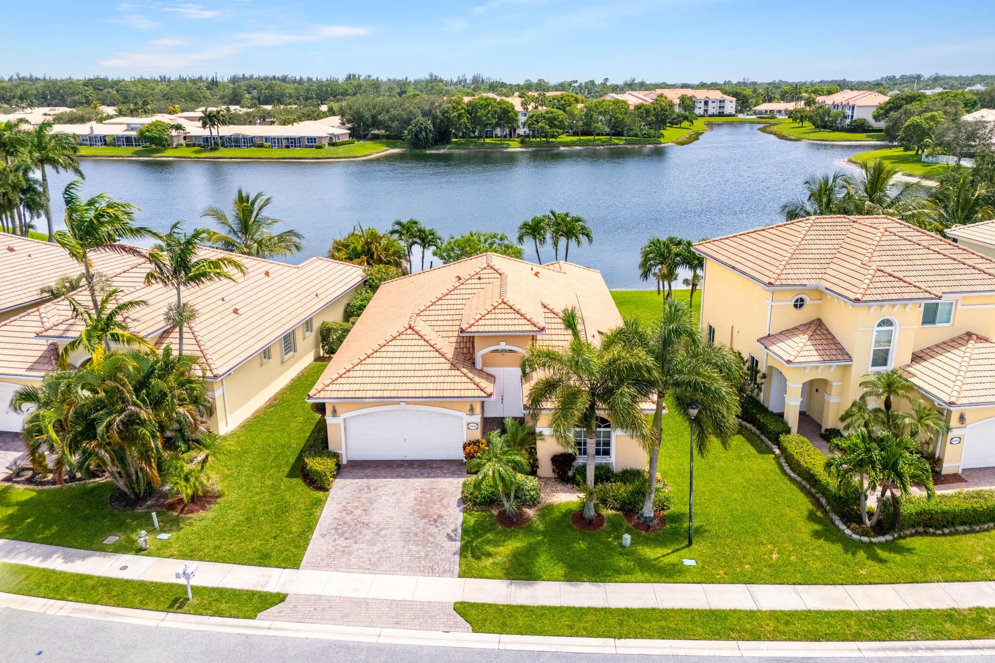 Welcome Home to your lakefront retreat in the highly sought-after Andros Isle community! This beautifully maintained 3-bedroom, 2-bath home offers 1,822 sq ft of light-filled living space with volume ceilings and a 2-car garage. The kitchen and main bathroom were tastefully remodeled in 2020, featuring quartz countertops and modern finishes.Step outside to your private screened-in patio and enjoy a serene backyard oasis with a tranquil pond, blooming water lilies, and a cascading waterfall overlooking the lake--a peaceful setting perfect for relaxing or entertaining.Andros Isle offers resort-style amenities, including a clubhouse, fitness center, billiards room, pool, hot tub, tennis courts, jogging paths, and more.Florida living at its finest--schedule your private showing today!