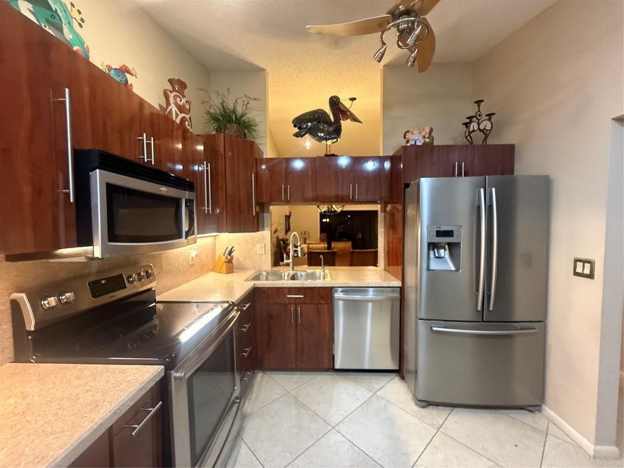 COMING SOON* PROFESSIONAL PHOTOS* NEW ROOFS, Beautiful waterfront villa coming very soon! Ginger Tree HOA allows for FHA & VA buyers but association requires 10%* large 24 x 24 travertine style tile on a 45 degree angle throughout the entire property*Vaulted ceilings* UPdated kitchen  and bathroom cabinets* stainless steel appliancs * French door fridge * NEW AC 2025*washer dryer newer in laundry room * storage unit on Florida room*Walk in closet isn’t big enough word to describe with built in cabinets*Lakeview* Accordion shutters* courtyard *Onyx top vanity 2nd bathroom *NO LEASING*10% required*Amenities of the township* stunning in person *Seller offers 1 year maintenance fee with full price offer TO BUYER. Seller is almost moved OUT, shows well*2000 quarter/189 quarter master assoc.