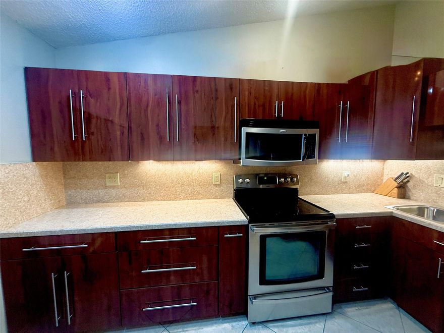 COMING SOON* PROFESSIONAL PHOTOS* NEW ROOFS, Beautiful waterfront villa coming very soon! Ginger Tree HOA allows for FHA & VA buyers but association requires 10%* large 24 x 24 travertine style tile on a 45 degree angle throughout the entire property*Vaulted ceilings* UPdated kitchen  and bathroom cabinets* stainless steel appliancs * French door fridge * NEW AC 2025*washer dryer newer in laundry room * storage unit on Florida room*Walk in closet isn’t big enough word to describe with built in cabinets*Lakeview* Accordion shutters* courtyard *Onyx top vanity 2nd bathroom *NO LEASING*10% required*Amenities of the township* stunning in person *Seller offers 1 year maintenance fee with full price offer TO BUYER. Seller is almost moved OUT, shows well*2000 quarter/189 quarter master assoc.