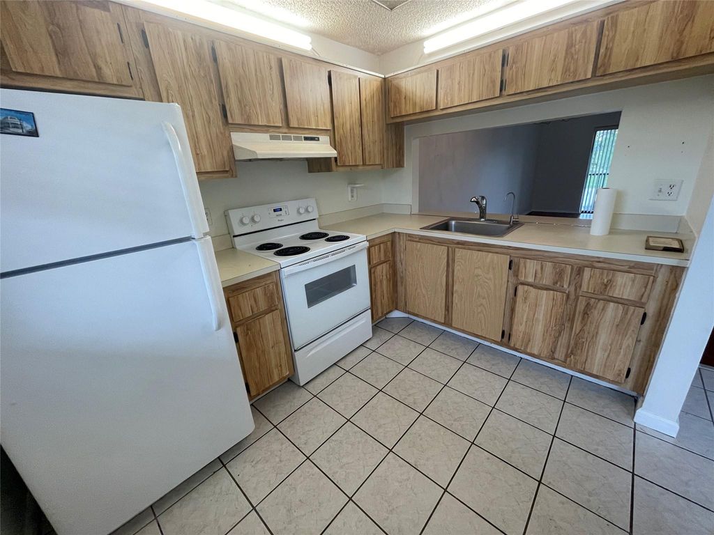 Photo of 143 NW 93rd Avenue #202, Pembroke Pines, FL 33024 (MLS # B26042123)