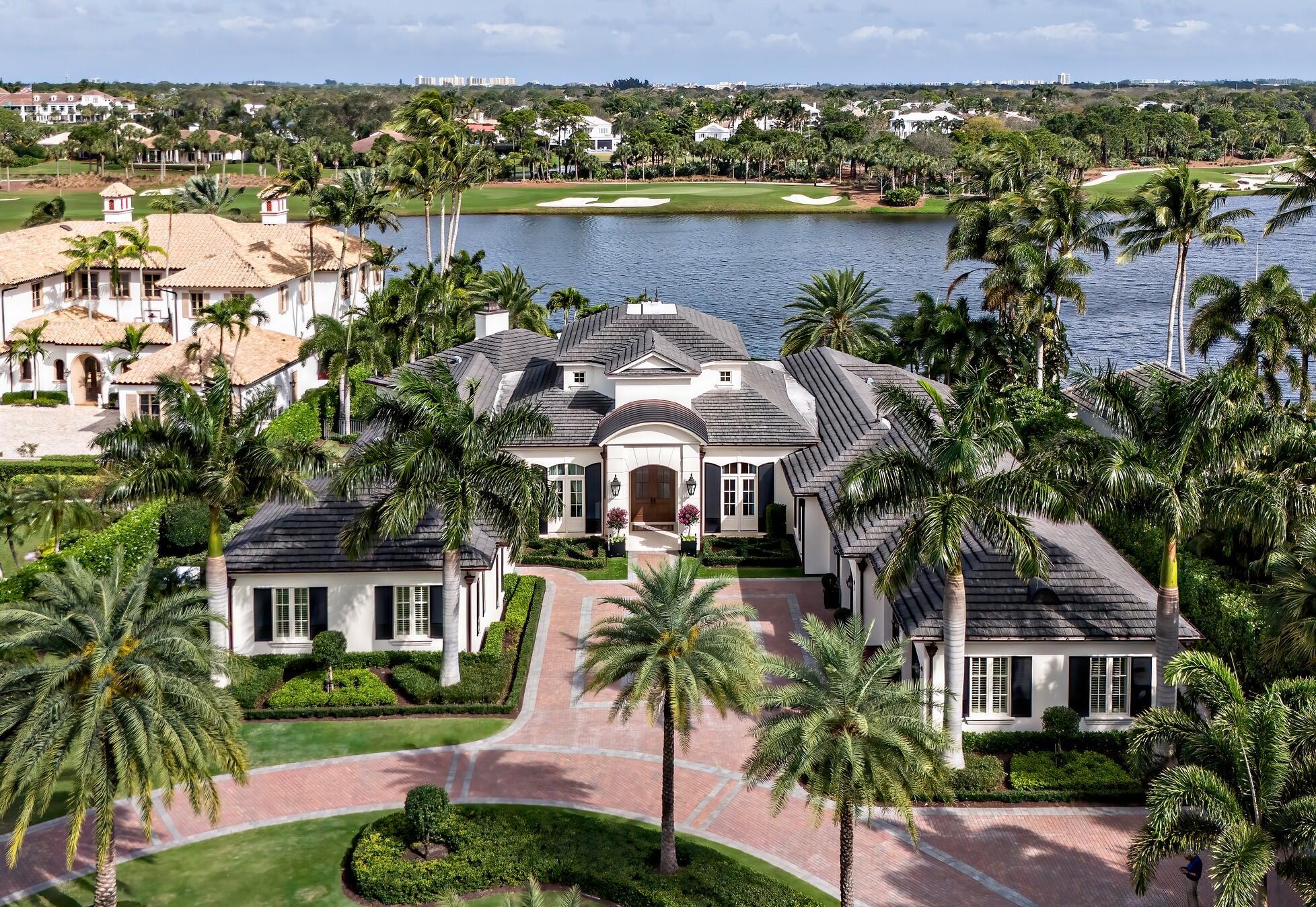 Presenting an unparalleled waterfront residence on a spectacular .8 acre lakefront lot within the prestigious Loxahatchee Golf Club. This sprawling 6,355 square foot single-story estate has been masterfully rebuilt in 2020, offering a total of 9,150 square feet of luxurious living space designed for those who appreciate the finer things in life.This exquisite home boasts an open floor plan that seamlessly blends indoor and outdoor living. The heart of this estate is a chef's dream, an oversized kitchen equipped with high-end gourmet appliances, perfect for culinary exploration. The adjoining wine room can house over 450 bottles, ensuring every occasion is well catered for.SEE MORE