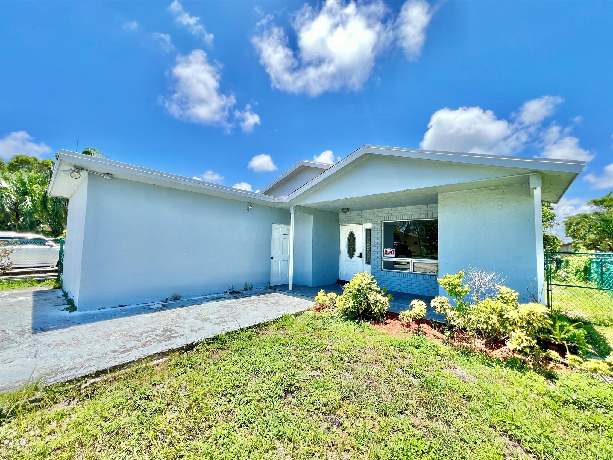 No HOA single family residence. Three spacious bedrooms with closets. Fenced back yard with Mango & Avocado trees to provide plenty of shade for relaxing. Extra large driveway for bigger vehicles or trucks, 4+ cars easily accommodated. Garage conversion needs finishing. Easily remodel into a 4/2, adding 207ft to living ft. Great rental, flip potential.