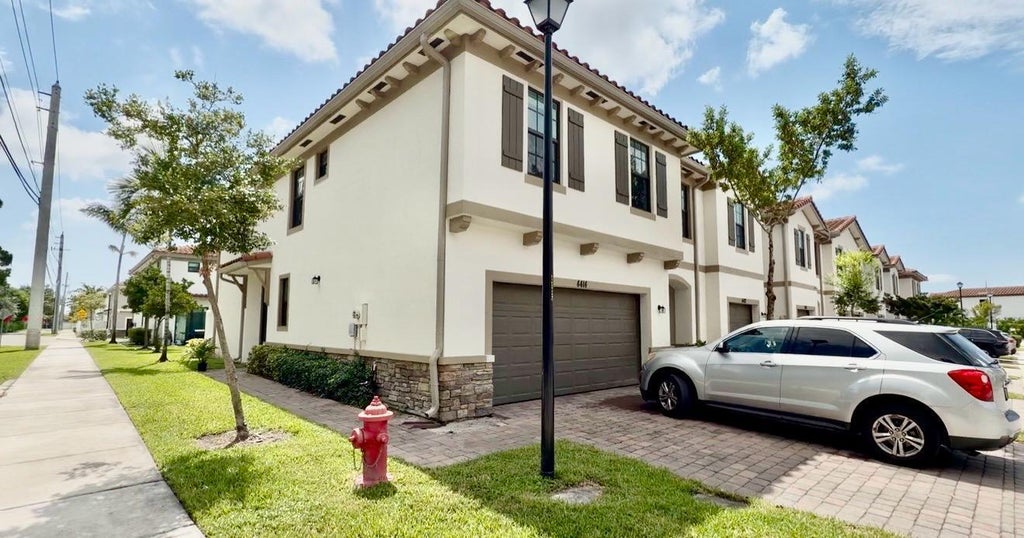 Photo of 4414 HEMLOCK Drive, Riviera Beach, FL 33410 (MLS # B26063429)