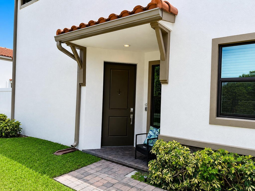 Photo of 4414 HEMLOCK Drive, Riviera Beach, FL 33410 (MLS # B26063429)