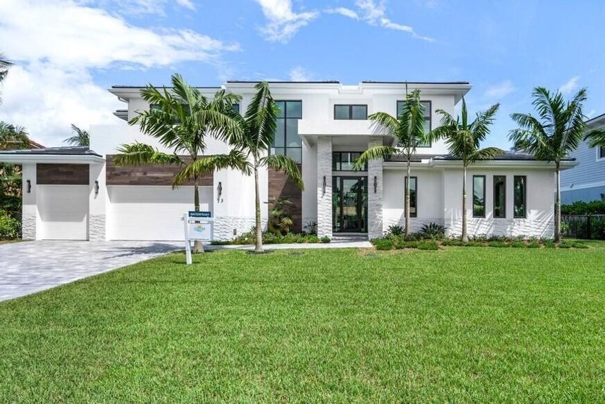 Fabulous custom home on deep water canal, ready for occupancy! This 2 story 5BR 5BA, 3 car garage home boasts 100' dock to accommodate a large fishing or yachting vessel.  Deep water, no fixed bridge and 15min to the Palm Beach Inlet, makes this home perfect for a boating enthusiast. The first floor in an open plan featuring chef's kitchen, Wolf appliances , large wine display refrigerator, oversized island, large wet bar with beverage center and walk-in pantry. The kitchen, dining room open to a covered patio, summer kitchen, outdoor living area, fireplace, pool and Spa. The 1st floor owners suite provides large closets and a luxury spa bath. The 2nd floor can be accessed by elevator and includes 4 BR and Club/game room. Bring the Big Boat!