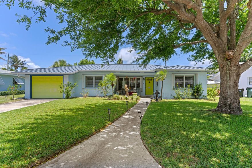 Classic updated College Park home east of Federal Hwy half block from the Intracoastal.  This 3 bedroom 2 bath home with a one car garage.  This property is on an over 9000 sq. ft lot 75 X 125.  CBS construction with porcelain tile thru-out (no carpet).  Standing seam metal roof installed 2021, air condition system replaced 2024, with all new duct work.  Stainless appliances include newer Bosch refrigerator, Bosch dishwasher replaced 2025, gas cooktop, electric convection oven (the perfect cooking combination), and GE Advantium (220V) microwave with speed and convenction cooking.  The master suite has a walk-in closet and updated bath.  The 2 other bedrooms are generous in size with large closets.  When exiting the dining room door onto the large patio to enjoy the South Florida weather