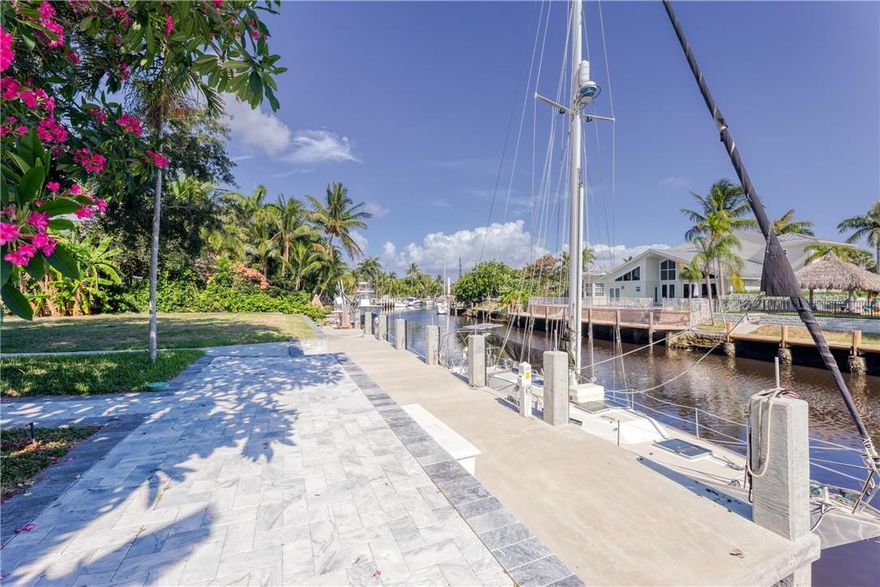 Fantastic opportunity to live on the water w/ ocean access & no fixed bridges. Large home w/ 3 beds, 2 baths,2 car garage & a den. Brand new concrete dock w/ power & water. Enjoy beautiful sunsets & waterviews from the covered patio, entertain family & friends, & let the kids or pets play in the large back yard. Tile floors throughout, French doors to the patio offer great water views & light from all of the living areas & guest bedroom, 2 living areas, and a semi open kitchen with breakfast bar.  Home can be rented partially furnished (inquire within) and is pet friendly. There is a 1/1 suite on premises that is occupied by a quiet tenant. Garage and dockage are shared. Available for immediate​​‌​​​​‌​‌​​​‌‌​​​‌‌‌​​‌​​‌‌​​​​ occupancy.