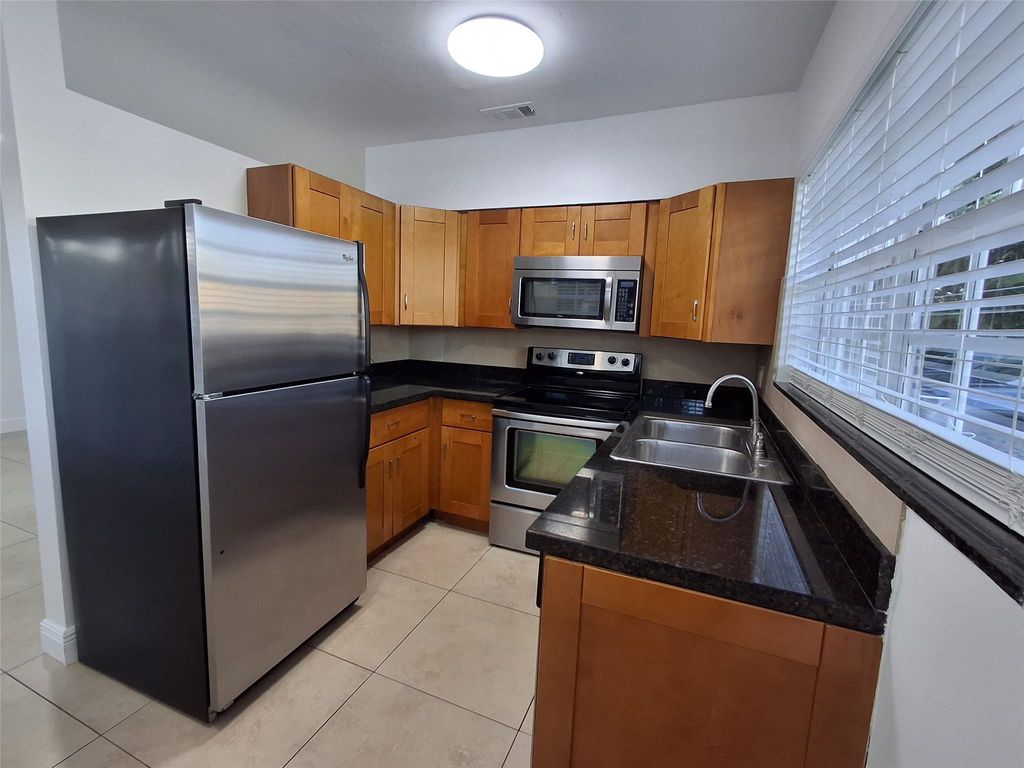 Photo of 1599 NE 34th Street #A, Oakland Park, FL 33334 (MLS # F10498830)