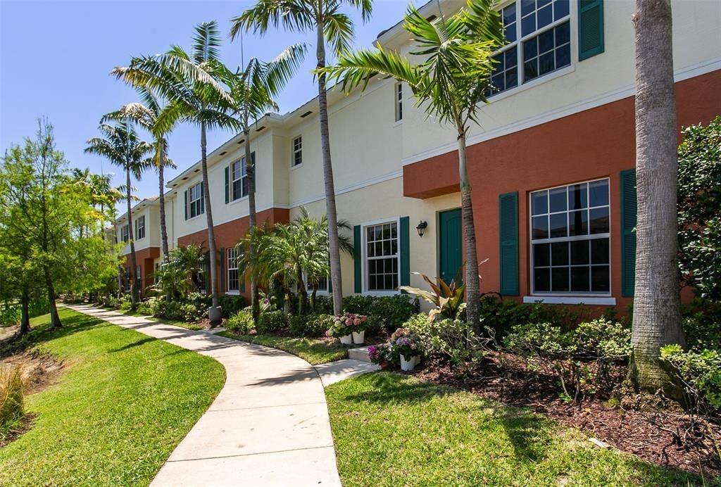 Luxury lakeside living awaits in the sought-after community of Orchid Grove, beautifully maintained corner unit—offers upgrades & a carefree lifestyle. Ground floor features easy-to-clean tile flooring & an open kitchen layout ideal for countertop dining or hosting in the formal dining room which flows gracefully into a spacious family room overlooking a serene fountain lake. A versatile bonus room w/convenient half bath adds extra space for entertaining. Upstairs, primary suite, a private retreat w/dual vanities, his-and-her closets, a generous soaker tub, separate shower, & a private commode area. Two well-appointed guest bedrooms share a full bath, & the second-floor laundry makes everyday living effortlessly convenient. Blending comfort, elegance, & lakeside charm. Make this your Home!