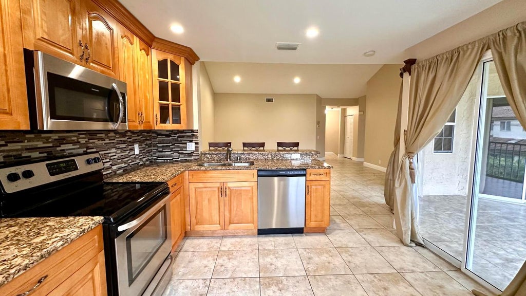 Photo of 6733 Via Regina, Boca Raton, FL 33433 (MLS # R10960982)