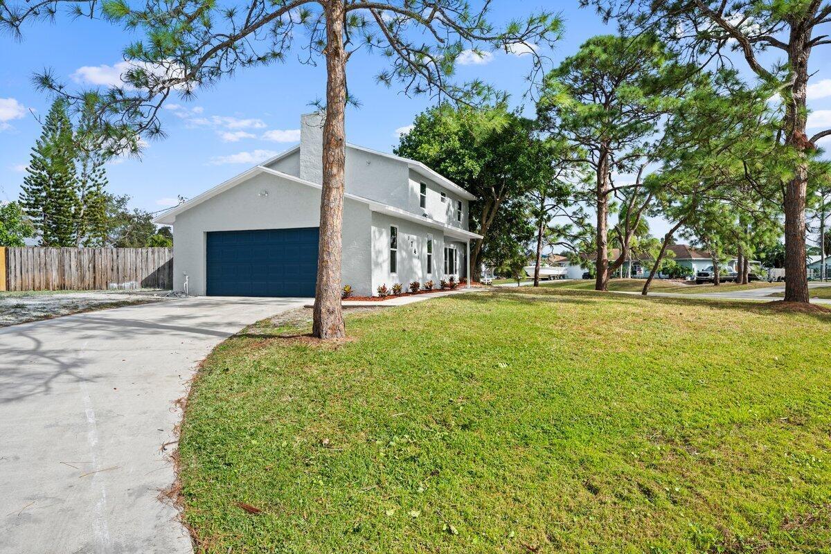This beautifully updated 4-bedroom, 3.5-bathroom home sits on a spacious corner lot, offering plenty of room to enjoy. The property features a sparkling pool, perfect for relaxing or entertaining, and impact windows for added security and energy efficiency. Inside, you'll find a bright, open floor plan with modern finishes throughout. The kitchen is equipped with high-end appliances and ample storage space. The large living and dining areas are perfect for family gatherings. The home also offers a 2-car garage and a large, fully fenced yard for privacy and outdoor enjoyment. Located in a desirable neighborhood, this home is move-in ready and waiting for you. Don't miss out--schedule your private showing today!