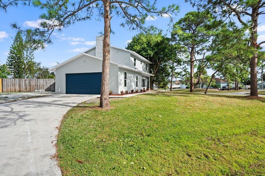 This beautifully updated 4-bedroom, 3.5-bathroom home sits on a spacious corner lot, offering plenty of room to enjoy. The property features a sparkling pool, perfect for relaxing or entertaining, and impact windows for added security and energy efficiency. Inside, you'll find a bright, open floor plan with modern finishes throughout. The kitchen is equipped with high-end appliances and ample storage space. The large living and dining areas are perfect for family gatherings. The home also offers a 2-car garage and a large, fully fenced yard for privacy and outdoor enjoyment. Located in a desirable neighborhood, this home is move-in ready and waiting for you. Don't miss out--schedule your private showing today!