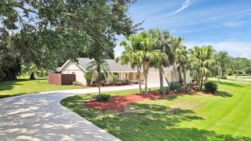 Experience quintessential Florida living on a rare half acre private retreat (and zero HOA fees) in the heart of coveted Sandpiper Bay. Completely renovated, this 3-bed/3-bath pool residence also offers a flexible den that could serve as a small 4th bedroom/office with ensuite & private entrance.Inside, sunlight pours through wide French doors, accentuating the huge open-concept great room that keeps everyone connected. At its heart is a show-stopping white kitchen -gleaming granite counters, large center island, Frigidaire(r) stainless appliances, deep drawers, and bar seating that bridges casual breakfasts and lively gatherings. The expansive living room flows naturally to the screened lanai, where a crystal-blue pool and generous covered patio invite year-round entertaining.