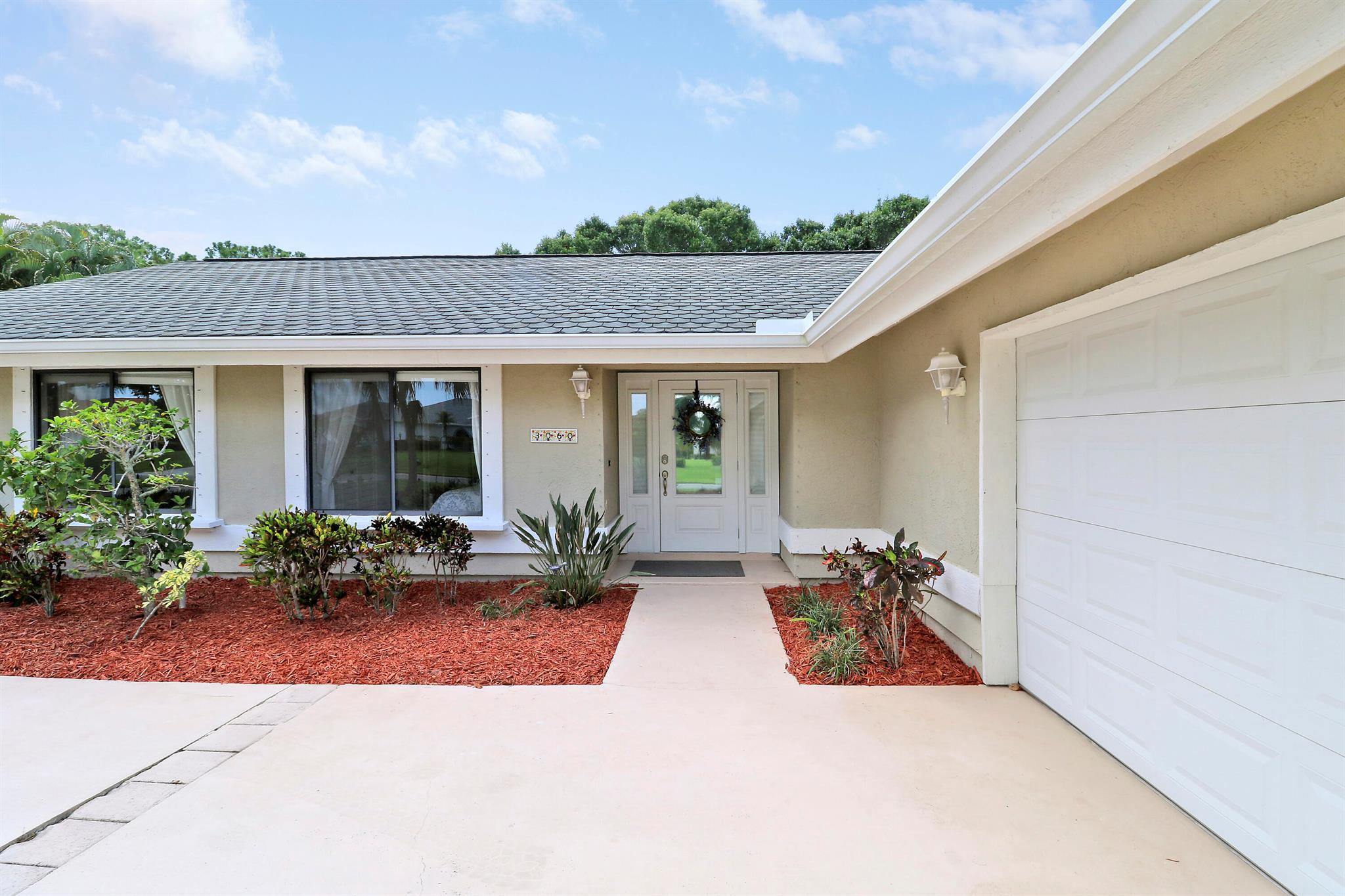 Experience quintessential Florida living on a rare half acre private retreat (and zero HOA fees) in the heart of coveted Sandpiper Bay. Completely renovated, this 3-bed/3-bath pool residence also offers a flexible den that might serve as a 4th bedroom/office with ensuite & private entrance.Inside, sunlight pours through wide French doors, accentuating the huge open-concept great room that keeps everyone connected. At its heart is a show-stopping white kitchen -gleaming granite counters, large center island, Frigidaire(r) stainless appliances, deep drawers, and bar seating that bridges casual breakfasts and lively gatherings. The expansive living room flows naturally to the screened lanai, where a crystal-blue pool and generous covered patio invite year-round entertaining.