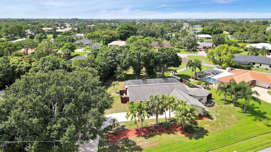 Experience quintessential Florida living on a rare half acre private retreat (and zero HOA fees) in the heart of coveted Sandpiper Bay. Completely renovated, this 3-bed/3-bath pool residence also offers a flexible den that might serve as a 4th bedroom/office with ensuite & private entrance.Inside, sunlight pours through wide French doors, accentuating the huge open-concept great room that keeps everyone connected. At its heart is a show-stopping white kitchen -gleaming granite counters, large center island, Frigidaire(r) stainless appliances, deep drawers, and bar seating that bridges casual breakfasts and lively gatherings. The expansive living room flows naturally to the screened lanai, where a crystal-blue pool and generous covered patio invite year-round entertaining.