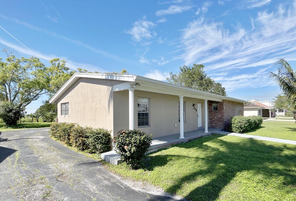 Photo of 140 Royal Palm Way, Belle Glade, FL 33430 (MLS # R10963642)