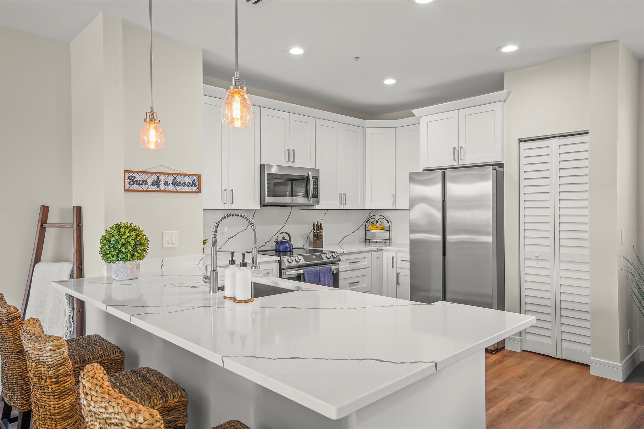 Beautifully updated 3/3.5 Corner unit townhouse available in the gated community of Atlantic Grove. Brand new Custom kitchen, new Samsung appliances, new flooring and custom molding throughout. Updated bathrooms in 2022. Live the downtown Delray Beach lifestyle. Walking distance to the 100 + restaurants, bars & the beach. It's in the heart of downtown & directly across the street from the Delray Tennis Center. making it easy to walk for tennis and pickleball, The community is currently rebuilding an all new pool deck, adding a dog park & new landscaping to enhance it.
