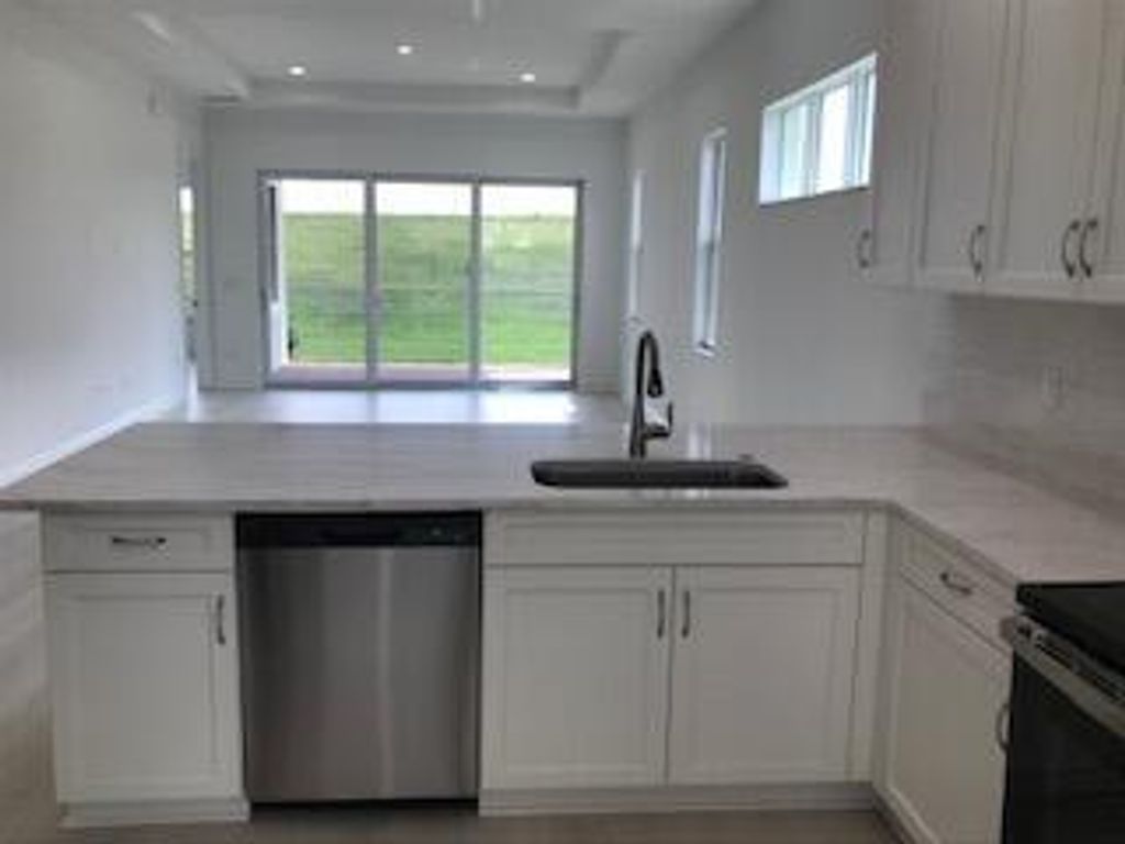 Photo of 9231 SW Pepoli Way, Port Saint Lucie, FL 34987 (MLS # B26032260)