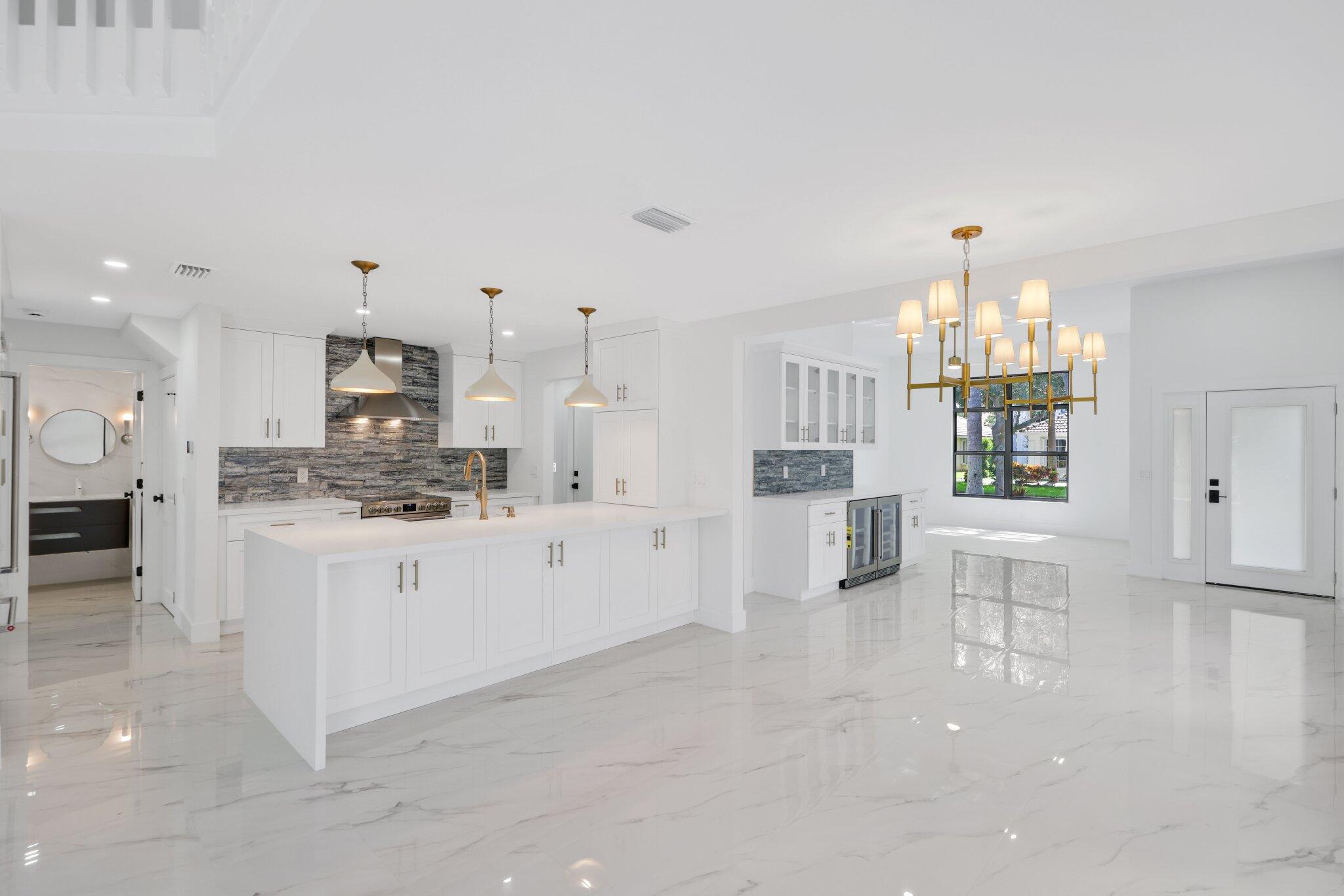Beautifully Renovated Home in Gated Delray Lakes CommunityThis elegantly renovated and meticulously maintained home is located in the sought-after gated community of Delray Lakes in East Delray Beach. Featuring 4 bedrooms and 3.5 bathrooms, it is one of the larger floor plans in the neighborhood and offers generous living space with scenic lake views.The thoughtfully designed layout includes both the master and junior master suites on the first floor, along with a convenient half bath for guests. Upstairs, you'll find two additional bedrooms, a full bathroom, and a spacious carpeted loft--ideal for a home office, playroom, or media space. A bonus storage room is accessible from the fourth bedroom.Every detail has been updated: enjoy brand-new appliances, a new washer and dryer,