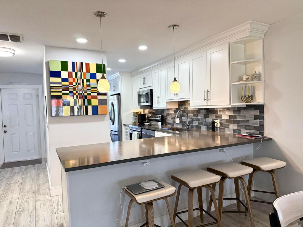 Photo of 1360 NW 19th Terrace #202, Delray Beach, FL 33445 (MLS # R11151044)