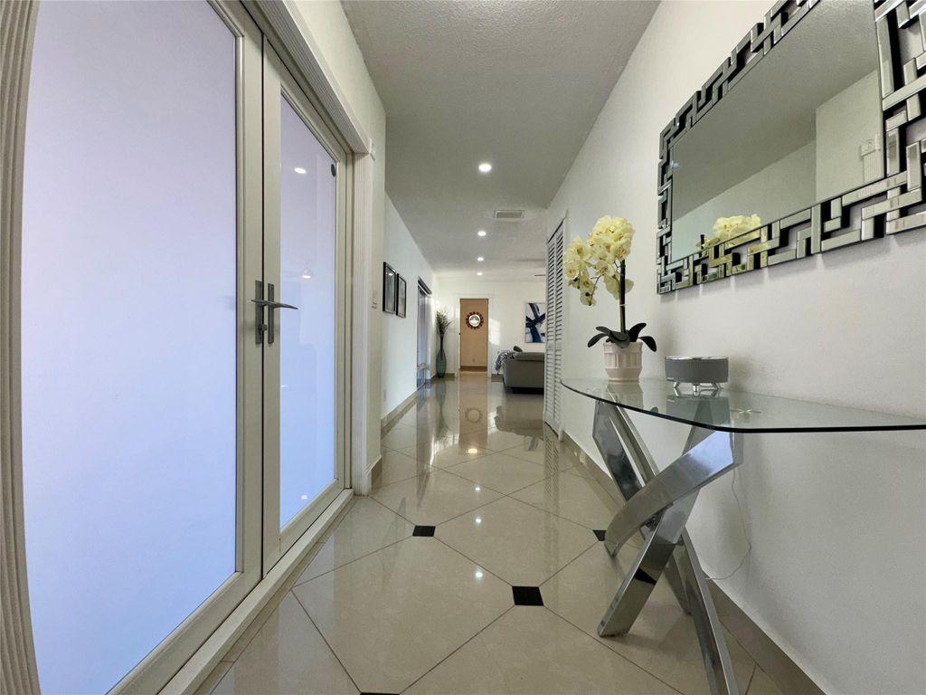 Photo of 481 W Tropical Way, Plantation, FL 33317 (MLS # B26003214)