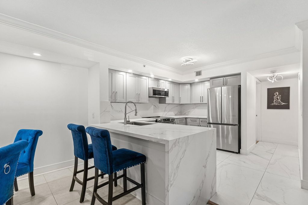 Photo of 4180 W San Marino Boulevard #107, West Palm Beach, FL 33409 (MLS # B26019400)