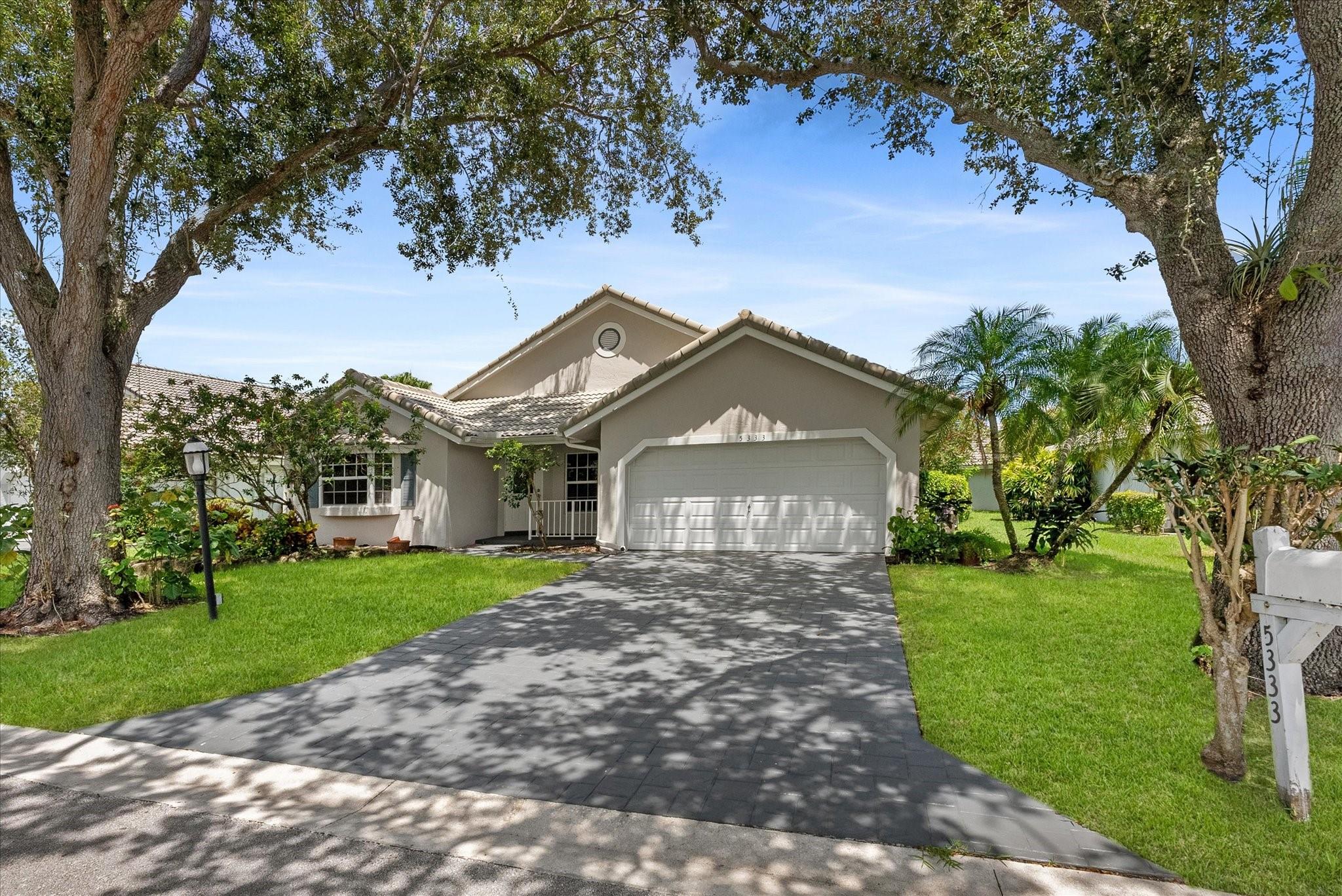 Single Family home with 3 Bedrooms, 2 Bathrooms, 2 Car Garage, Laundry Room, Impact Windows/Doors. This lovely home is in one of the area’s most sought-after communities. From its charming curb appeal and welcoming front porch to its light-filled interior, it’s sure to win you over. Inside, soaring vaulted ceilings, a large picture window, and neutral tile floors create a bright, airy feel throughout the spacious living areas. The open kitchen features SS appliances & a sunny breakfast nook. The spacious primary suite offers light-toned laminate floors, generous closets, and an ensuite bath. The spacious screened porch is an ideal place to unwind. Residents enjoy a community pool and a convenient location. Just a short stroll to an A-rated elementary school