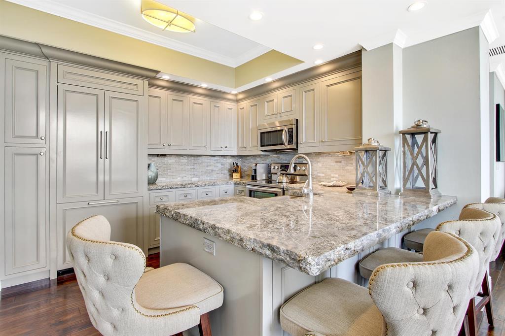 Own this newly updated breathtaking 2 bedroom plus den unit, with gorgeous wood floors spread throughout the spacious living room and bedrooms, as well as the kitchen which has stunning upgrades from the new backsplash to the new appliances and granite countertops, the grey finishes make this beauty look like a model! Each full bathroom blossoms with upgraded finishes, including marble walls and pebble shower floors, making each bathroom unique and elegant. Enjoy spectacular views of the city and intercostal from the wrap around living room, which beams with sunlight everyday keeping this unit nice and bright! Residents at One City Plaza can enjoy 24hr security, full service valet parking, steam room, sauna, fitness center,