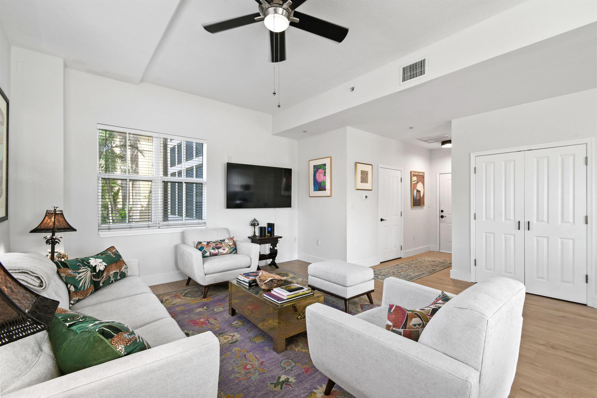 Experience the epitome of waterfront living in this spacious 1-bedroom, 1-bath residence at Flagler Landing, nestled directly on the Intracoastal Waterway. Boasting an oversized balcony with breathtaking views, high ceilings, and abundant natural light, this apartment offers a serene retreat. Hardwood floors and blinds throughout add elegance to the modern interior. Flagler Landing provides exclusive amenities including a community pool overlooking the renowned Rybovich Marina, a fitness center, and 24-hour guarded gate security. Residents also enjoy privileged access to the private dockside restaurant situated within the marina, perfect for waterfront dining experiences.