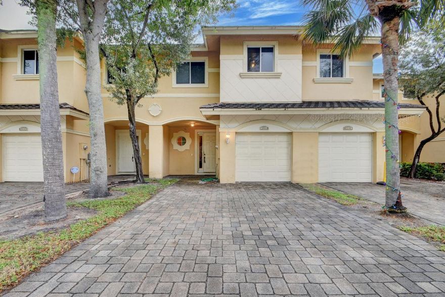 Don't miss out on this amazing opportunity! This 3 bed, 2.5 bath townhouse in Coventry, Lake Worth is the best-priced property on the market. Spanning over 1800 sqft under AC, a 1 car garage + double paved driveway, and a stunning waterfront view. The kitchen features a breakfast bar, separate dining area, and a huge living room. The master bedroom is generously sized with a double vanity, Roman tub, and separate shower. Upstairs, you'll find a convenient laundry room with newer appliances. Front porch & covered back patio overlooking the lake.  Community offers central location close to shopping, golf, turnpike, I-95, approximately 5 miles to the public beach & 7 miles to the airport.