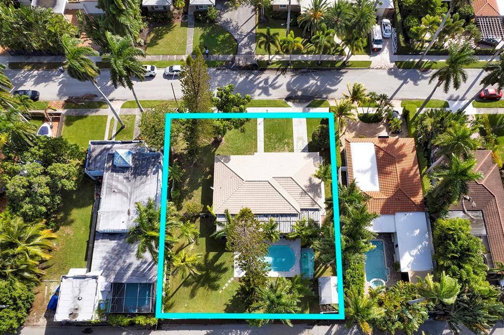 LOCATION COUNTS... Enormous Double Lot in Hollywood Lakes! RARE oversized lot (12,795)that is situated in the prime area of Hollywood Lakes...The tax records shows the living area square footage of this home to be 1,800 Sq ft +/-. Huge backyard with oversized pool. Large screened-in porch. Roof is in excellent condition. NATURAL GAS RANGE.. PERFECTLY LOCATED property- east of 13th ave.. The home needs some TLC - Separate in-laws quarter with full bedroom/bath and kitchenette. Renovate this home to your own style. Phenomenal Location- a block away from SouthLake.. 1.2 miles to the beach.. easy access to Hollywood Blvdwalk/bike to beach. 10 minutes away to FLL airport, 5 min. downtown Hollywood.