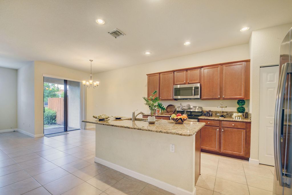 Photo of 10385 Wellington Parc Drive, Wellington, FL 33449 (MLS # B26034548)