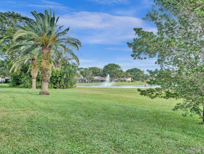 Say hello to your new home in Boca Lago, the wonderful 55+community that has 2 pools, clubhouse and a walking trail. Great location. The condo is light and bright and has a glass enclosed Florida room that has view of the preserve. Just painted. Closets have built outs and loads of closets. 4 in primary bedroom. Newer a/c, hot water heater and washer and dryer in unit!