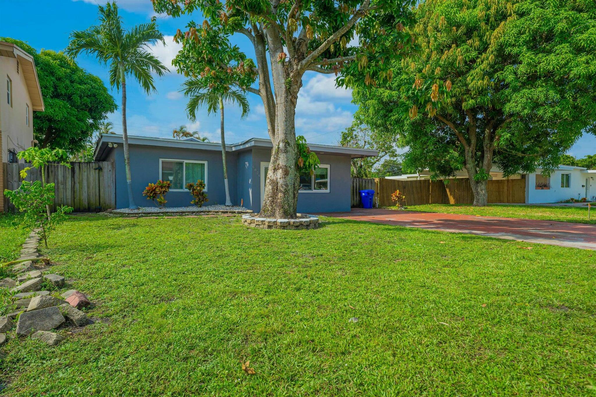 Beautifully renovated and rare 4-bedroom home nestled in the heart of Pembroke Pines! Featuring impact windows, a brand-new roof, and a massive backyard, this property blends style and peace of mind. The open-concept layout flows seamlessly into a spacious kitchen perfect for entertaining, while generously sized bedrooms offer plenty of room to relax. Immaculate finishes throughout make this home truly move-in ready. There's so much to love--schedule your showing today before this gem is gone!