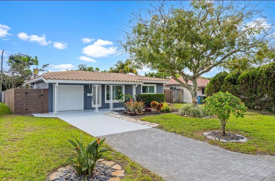Welcome to your beautifully updated 2 bedroom, 2 bathroom home in highly desirable Oakland Park. Completely turn-key and move-in ready, this residence offers the perfect combination of comfort, style, and location. Inside, you'll find a bright and open layout with modern finishes throughout, designed for both everyday living and effortless entertaining. Impact windows provide added security and energy efficiency, while the attached one-car garage adds convenience and extra storage. Step outside to a spacious backyard—perfect for relaxing, entertaining, or creating your own private outdoor oasis.  Ideally located just approximately 3 miles from the beach and minutes to shopping, dining, and entertainment, this home places you right in the heart of South Florida living. Call to set showings