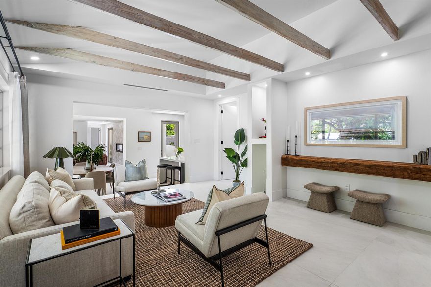 Available Dec - April! Enjoy the ultimate winter getaway in this fully renovated and fully furnished Flamingo Park home--blending historic charm, modern luxury, and an unbeatable West Palm Beach location. Reimagined in 2025 by award-winning Flamingo Park Development, this single-story residence offers effortless seasonal living with 4 bedrooms, 3.5 bathrooms, and high-end finishes throughout.Step inside to oversized porcelain tile flooring, exposed ceiling beams, beautiful natural light, and a striking dual-sided quartz-clad electric fireplace connecting the interior and exterior living areas. The chef's kitchen features a 48'' dual-fuel range, custom cabinetry, quartz countertops, and a large peninsula that flows into the dining and living spaces--ideal for entertaining during your sta