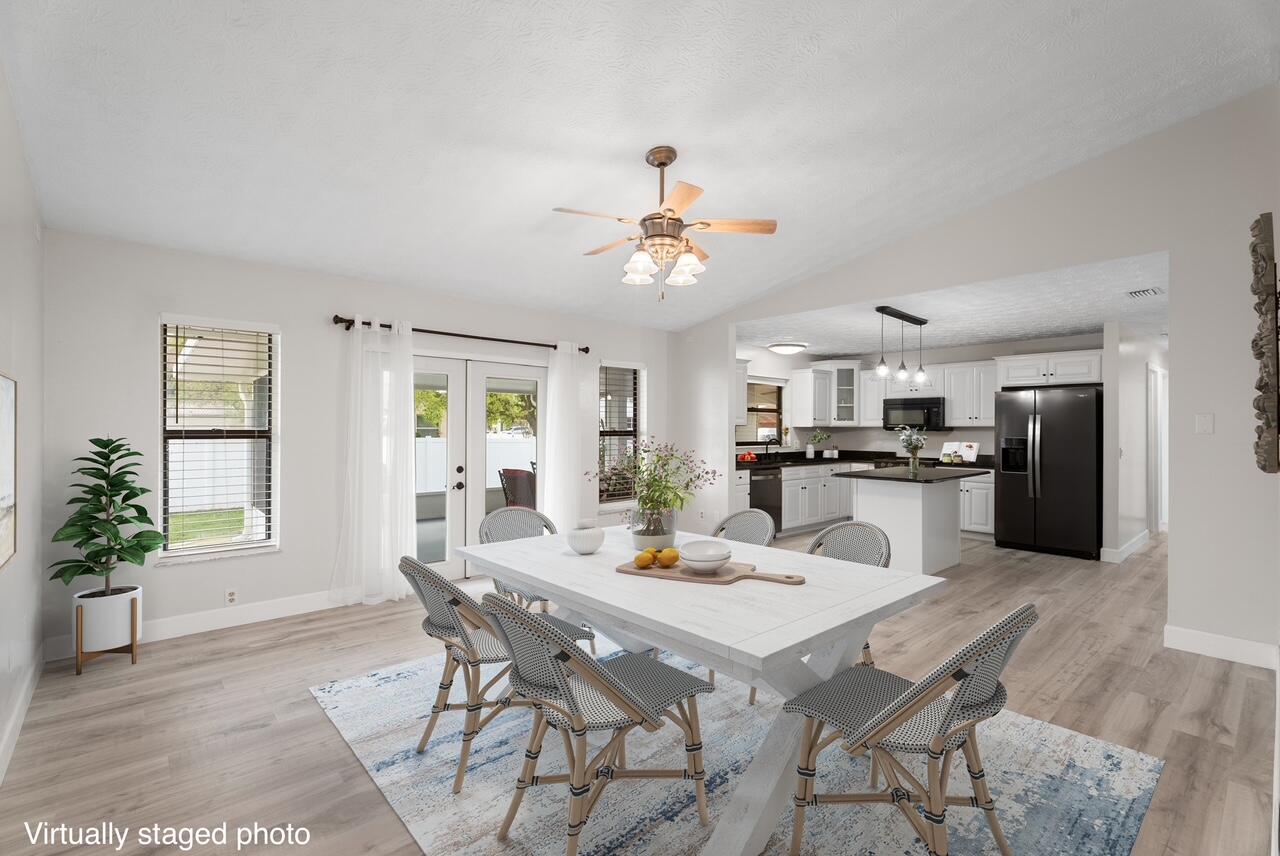 Welcome to this beautifully updated corner lot home, offering the perfect blend of comfort and modern touches. With a 2022 ROOF+ 4 Ton AC and fresh flooring throughout most of the house, this home is move-in ready and waiting for you! Inside, you'll find a remodeled master and guest bath with cabana door, showcasing stylish finishes and thoughtful details. A standout feature is the large third bedroom with a SEPERATE ENTRANCE, offering privacy and potential for a guest, in-law suite, or RENTAL opportunity with plumbing readily available for bathroom or kitchenette. The heart of the home features NEW APPLIANCES, freshly painted cabinets, and granite countertops ensuring a modern and efficient cooking experience.