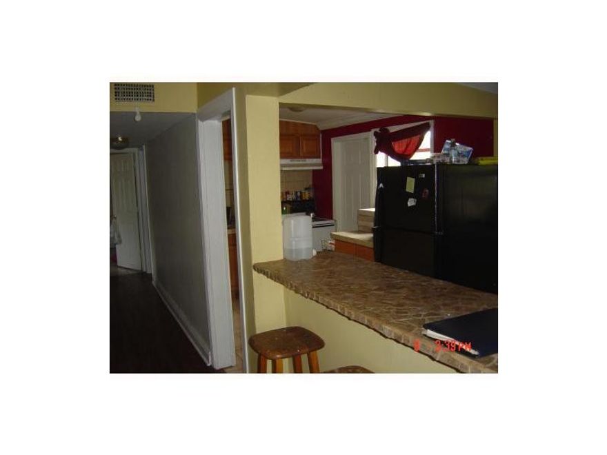 3/2 SINGLE FAMILY HOME with a carport.  Renovated, crown molding, tile, new roof!. great back yard!!!!!  No HOA. East of I-95