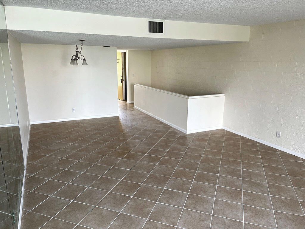 Photo of 2828 Tennis Club Drive #207, West Palm Beach, FL 33417 (MLS # B26045337)