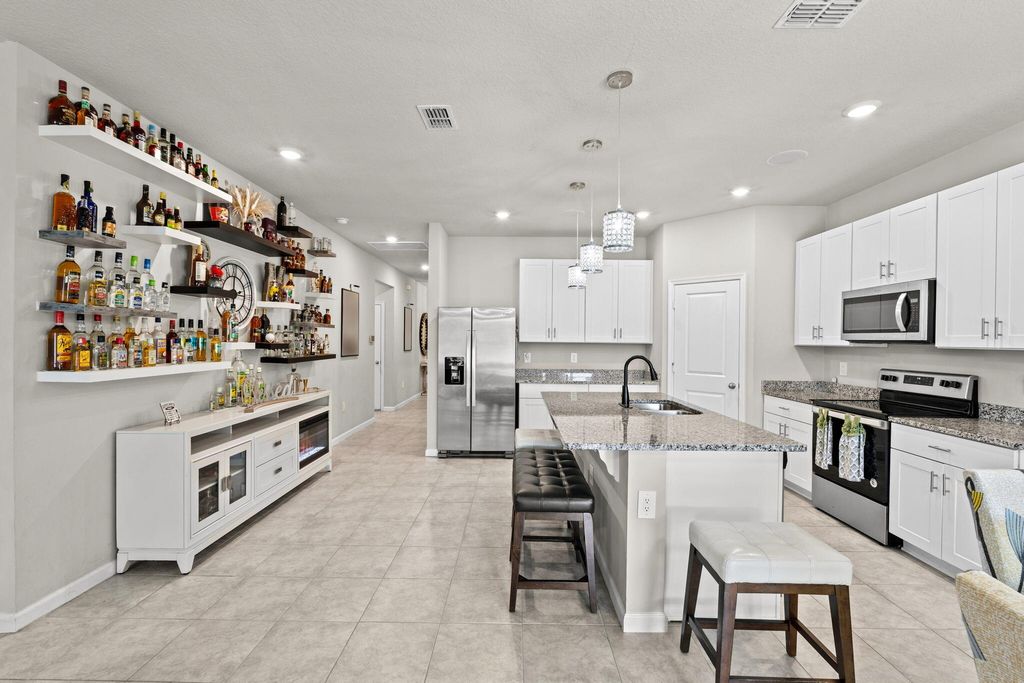 Photo of 3482 SW Rosser Boulevard, Port Saint Lucie, FL 34953 (MLS # B26017166)