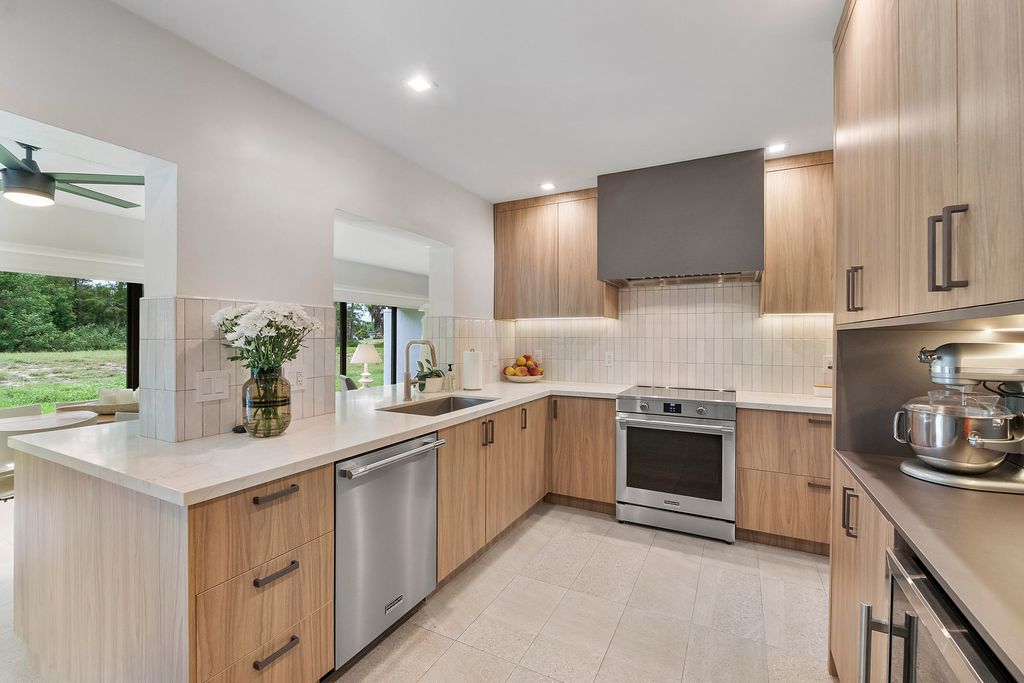 Photo of 4800 Queen Palm Lane, Tamarac, FL 33319 (MLS # B26045807)