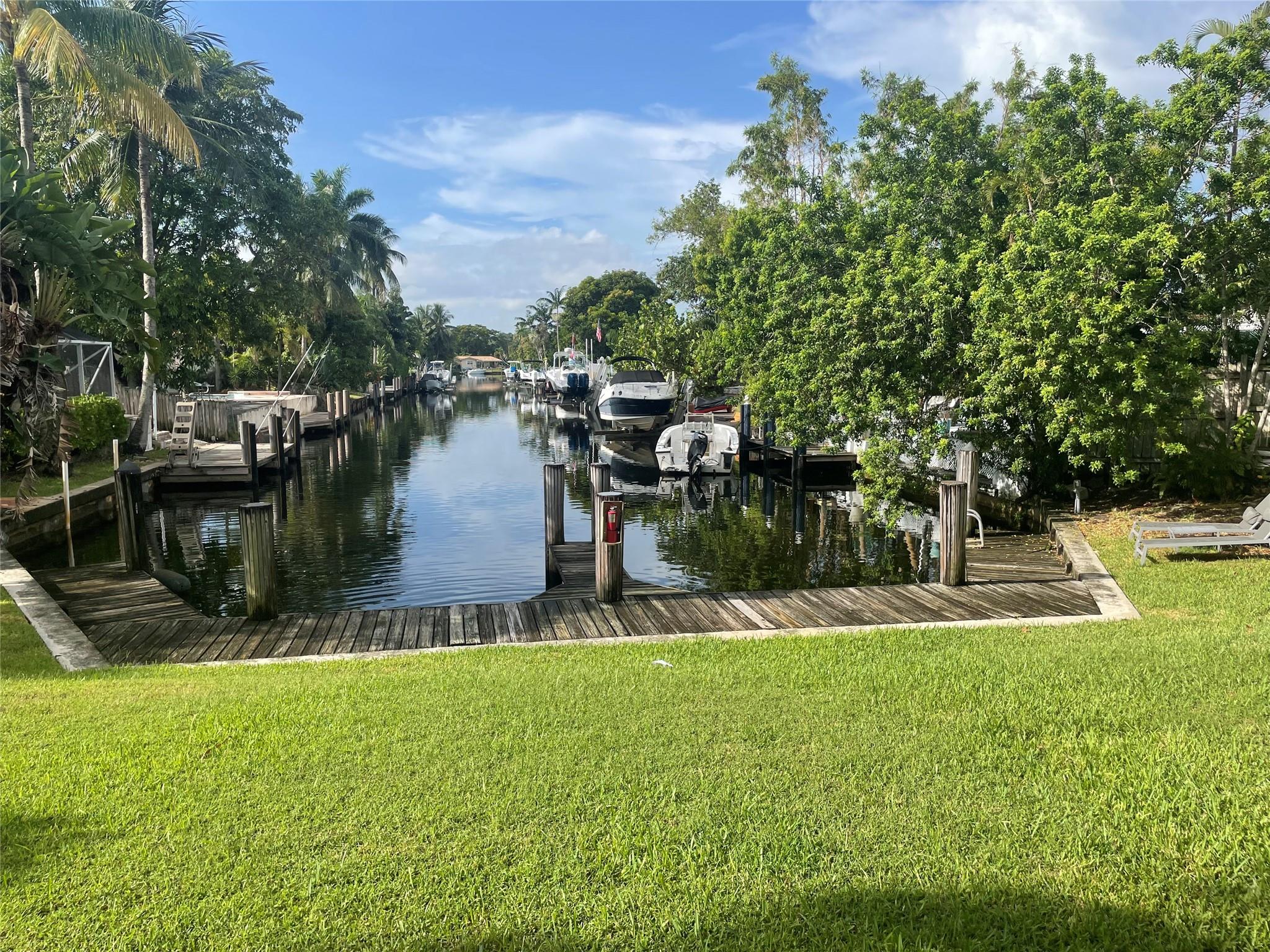 Enjoy serene waterfront living in this charming 2 bedroom 1 bath condo located in East Pompano Beach. This property features a bright and open living space, spacious bedrooms for your comfort. All Impact windows. Step outside to relax, perfect for morning coffee. Gated and secure building. Laundry room. Community pool, dock and patio! Ocean Access. Conveniently located near shopping, close to beach, dining and local attractions.