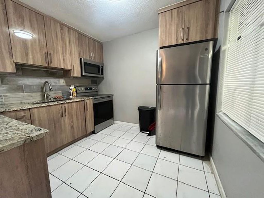 Photo of 4040 NW 31st Terrace #3, Lauderdale Lakes, FL 33309 (MLS # F10542436)