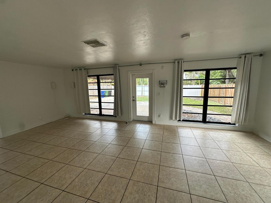 wOw! Ft Lauderdale 2 bedroom home -open  and airy. If you want that "Old Florida Feel - Laid Back and Simple" this is as close you are going to get. Tile floors, super fenced in yard with large shade trees. Close to to everything - (Las Olas, Riverfront I-595 and I-95). Large yard. Pet friendly. There is "NO HOA" and the street is very private