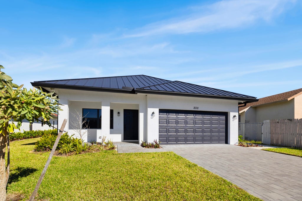 Photo of 2311 Zeder Avenue, Delray Beach, FL 33444 (MLS # R11160576)