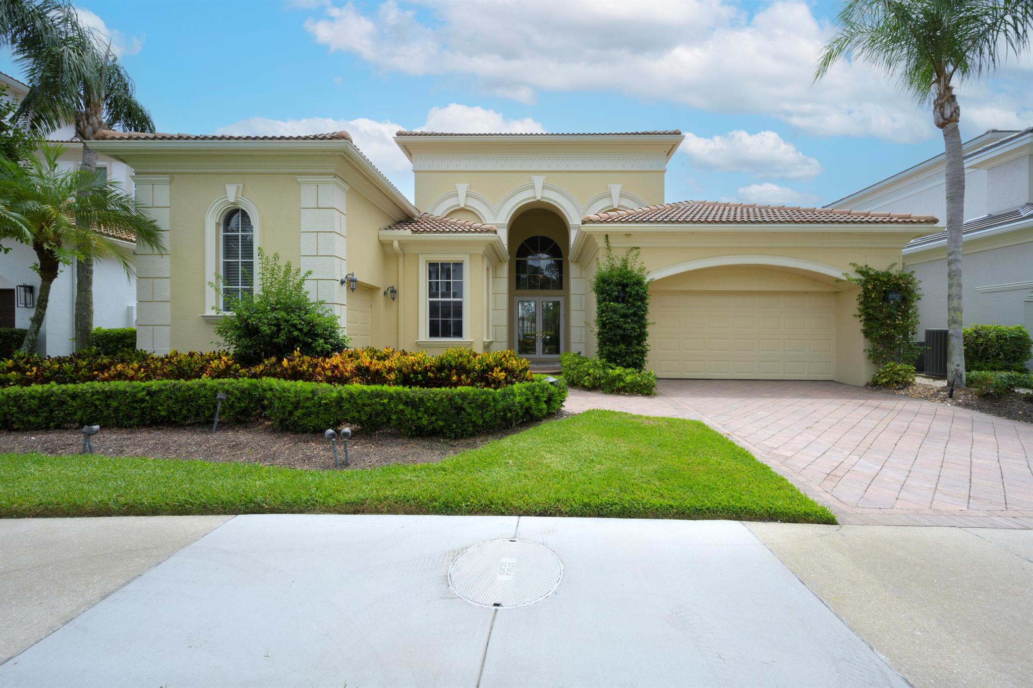 Come to see this light, bright, 1 story full golf home in the country club of Mirasol. The new porcelain floorsare throughout the living areas and new flooring in all the bedrooms. Freshly painted, redone kitchen with Italian appliances, new backsplash, and counter tops.Enjoy your tropical landscaped back yard with a large lanai and phantom screen which increases your living area to enjoy the lake view. The large pool and spa sits off to the side so there is plenty of space for tables, chairs and chaise lounges to enjoy the sun and view.